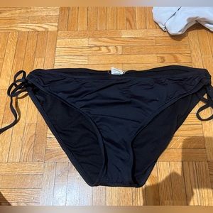 Mossimo women’s swim bottoms. Black with ties.  Size L